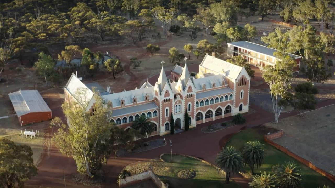 Aerial view of a large building in the outback.