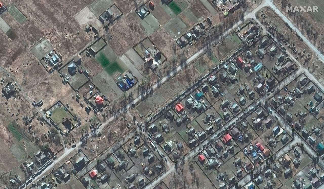 A satellite image provided by Maxar Technologies showing deployment of ground forces in Zdvyzhivka, north west of Kyiv.