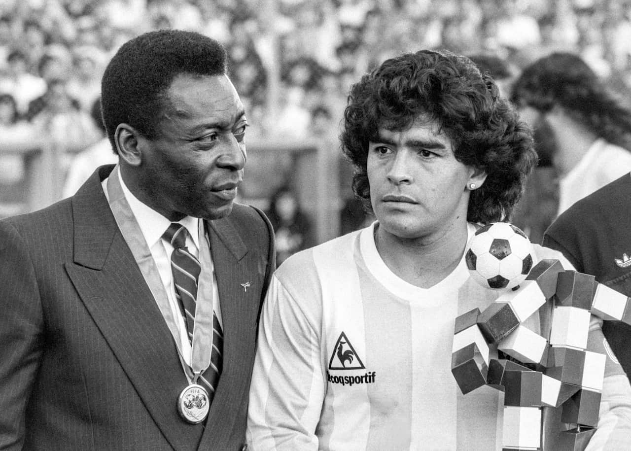 Pele stands next to Maradona