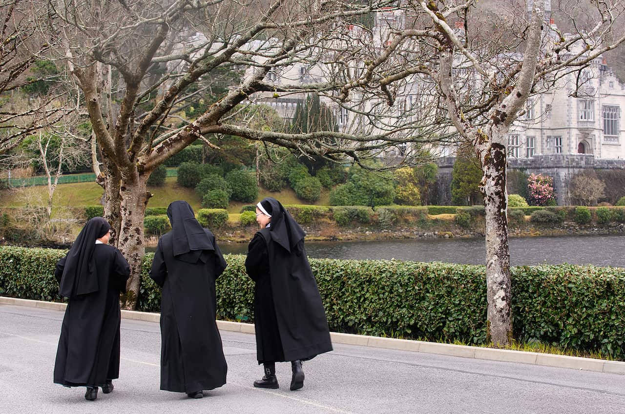 6.21 Benedictine nuns walking in front of Kylemore Abbey.jpg
