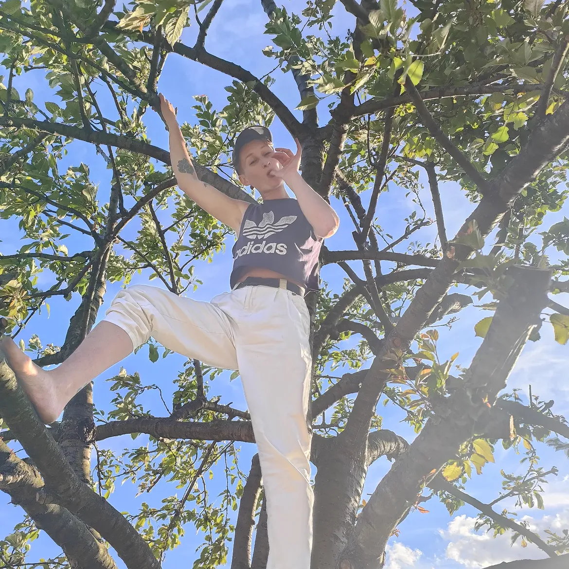 A person standing in a tree.