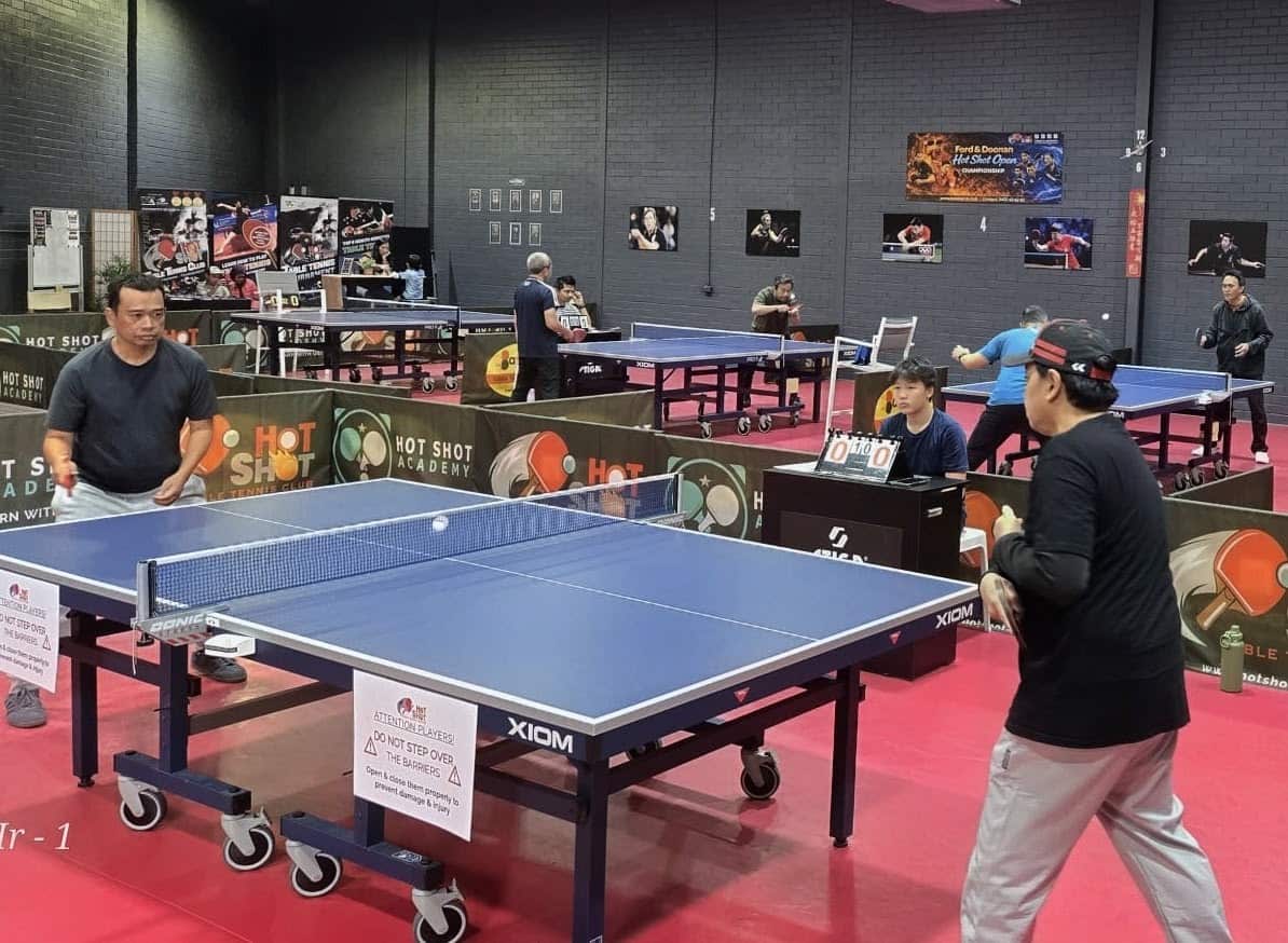 Two players compete during the table tennis tournament in Perth, held as part of Indonesia's Independence Day celebrations.