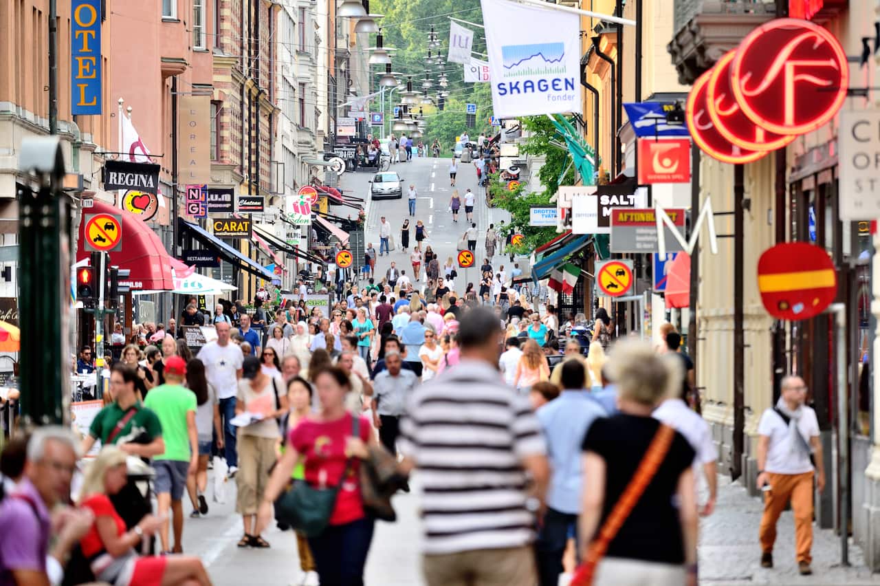 A street view of Stockholm, Sweden busy with pedestrians.