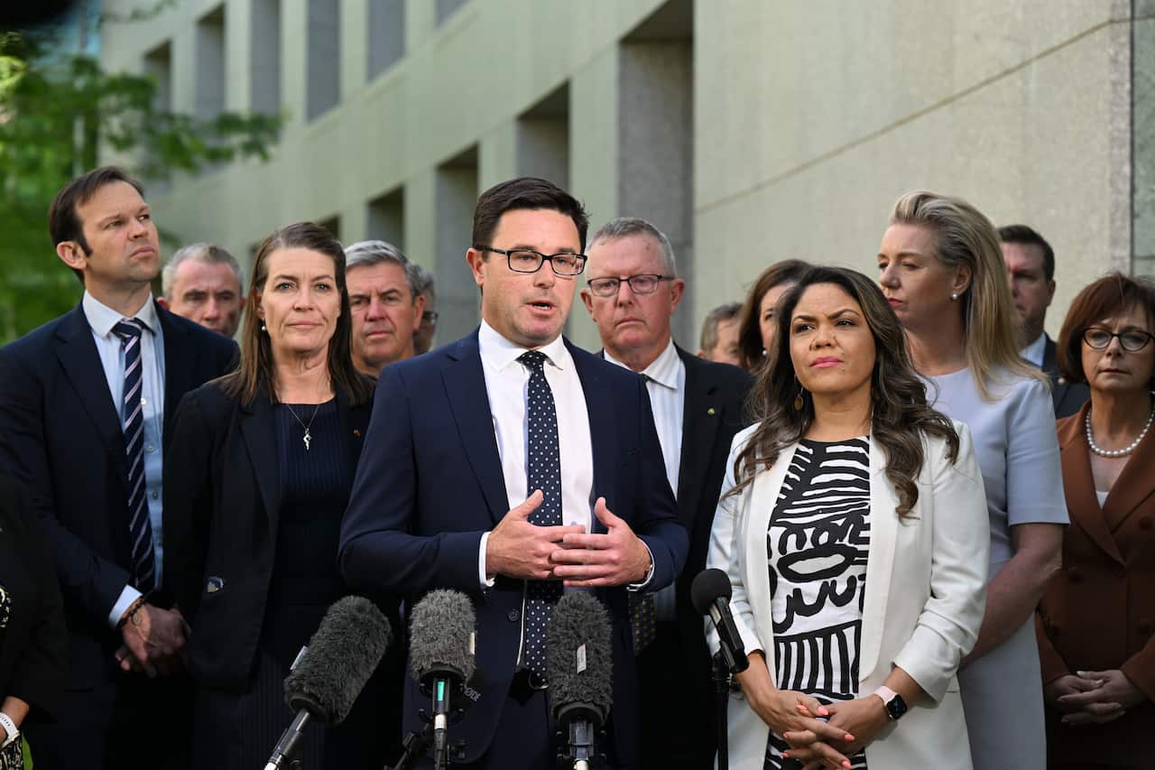 David Littleproud and Jacinta Price appear at a press conference with microphones, with nationals colleagues behind them