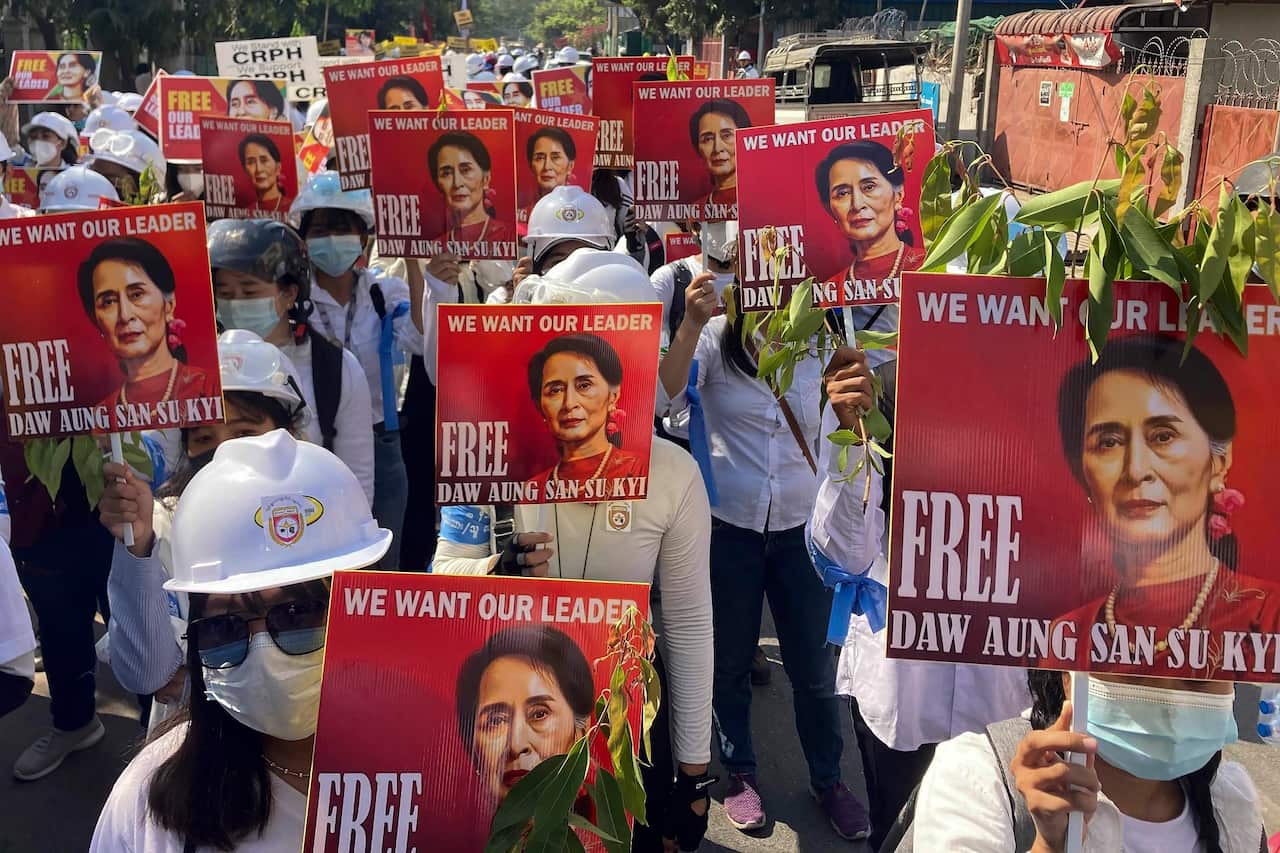 Protesters hold portraits of deposed Myanmar leader Aung San Suu Kyi during an anti-coup demonstration in Mandalay, Myanmar on 5 March 2021. 