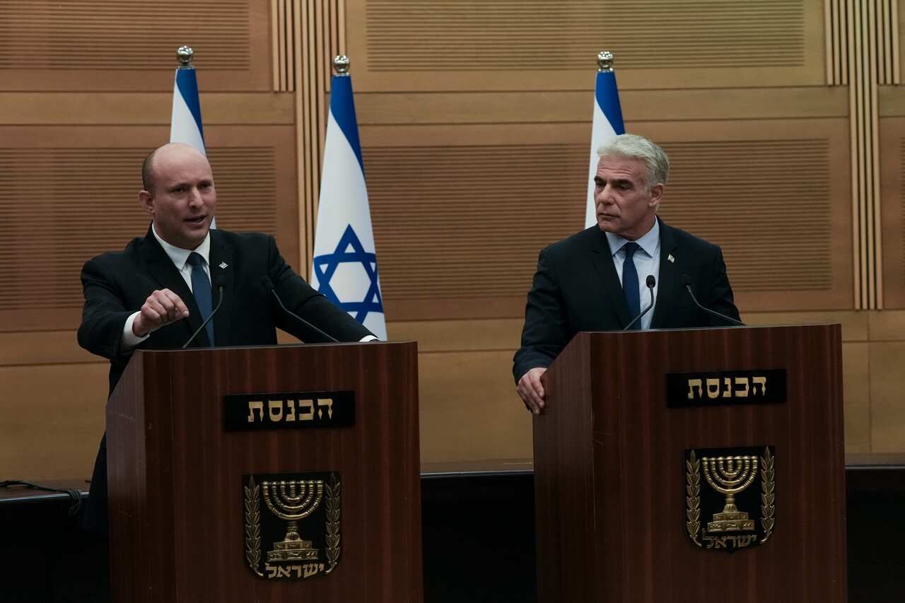 Israeli Prime Minister Naftali Bennett (left) speaks during a joint statement with Foreign Minister Yair Lapid (right)