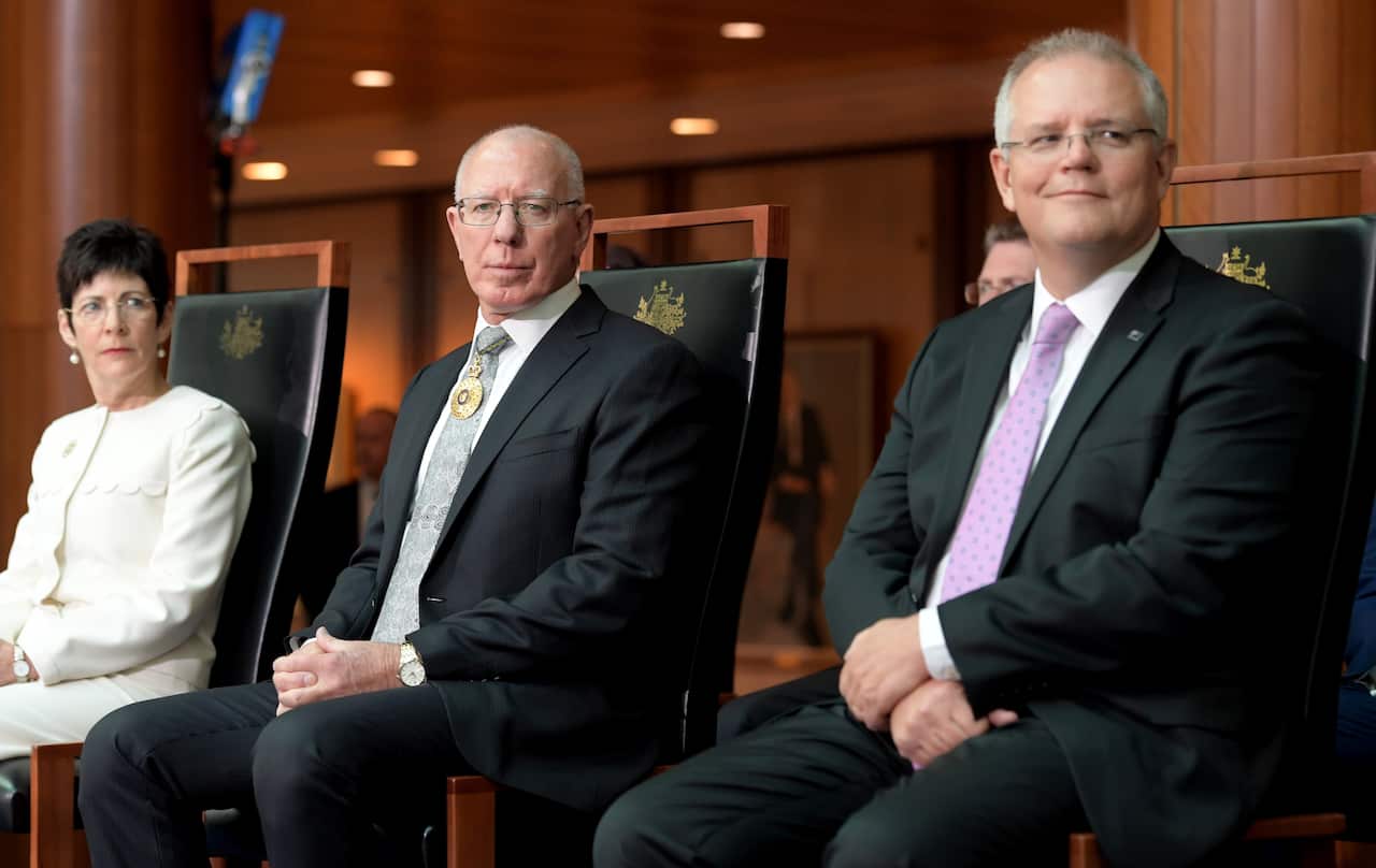 (left to right) Linda Hurley, David Hurley and Scott Morrison sitting on chairs in Parliament House.