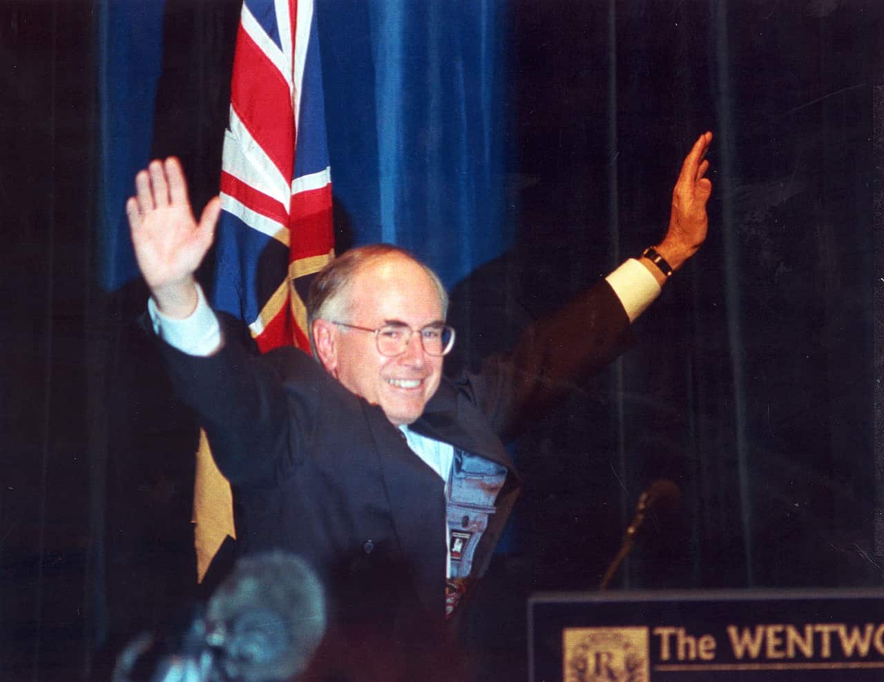 Former Liberal prime minister John Howard waves to the crowd in a Sydney Hotel on March 2 1996, as he acknowledges his federal election victory.