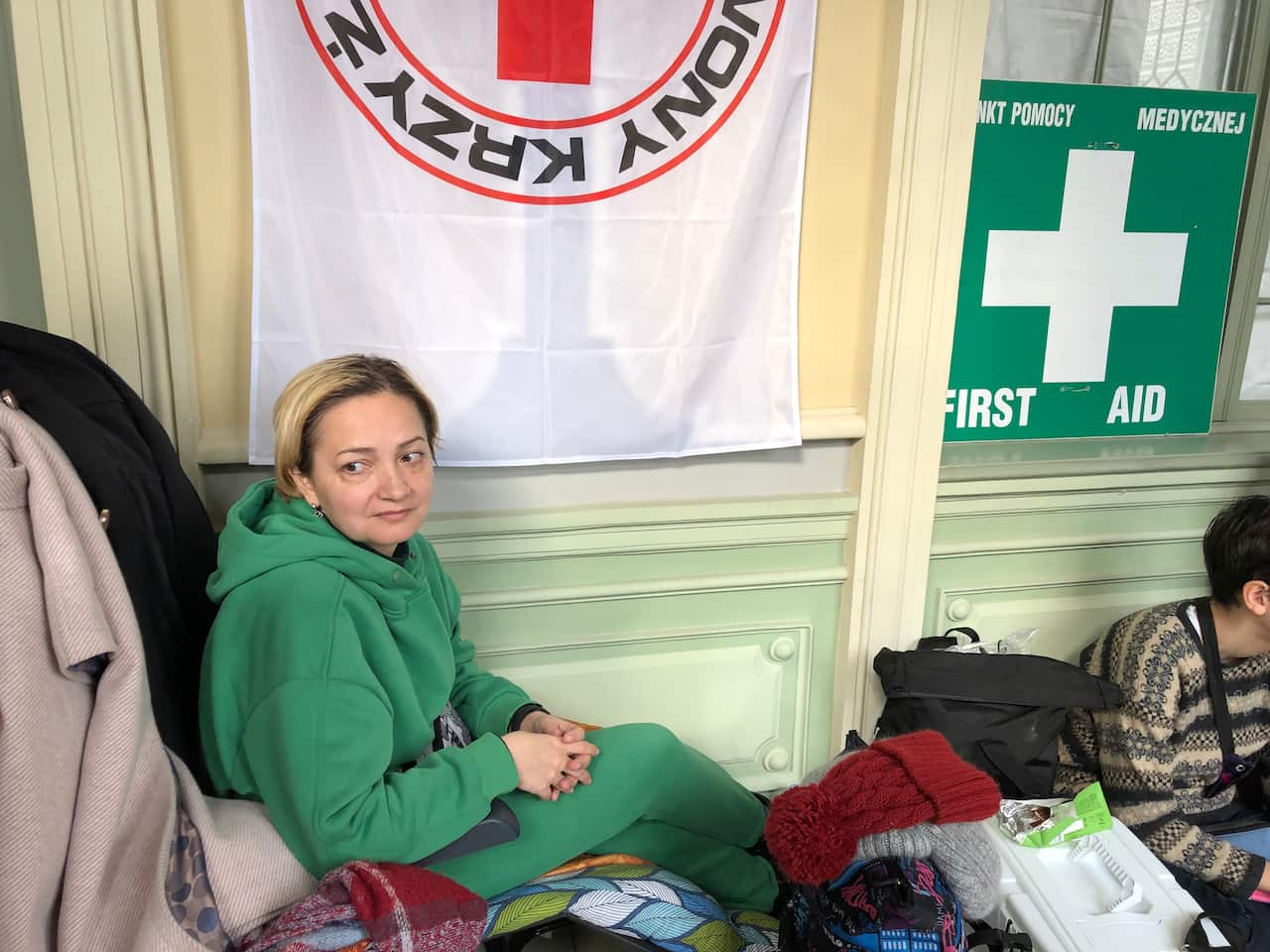 Maryana waits for the train. 