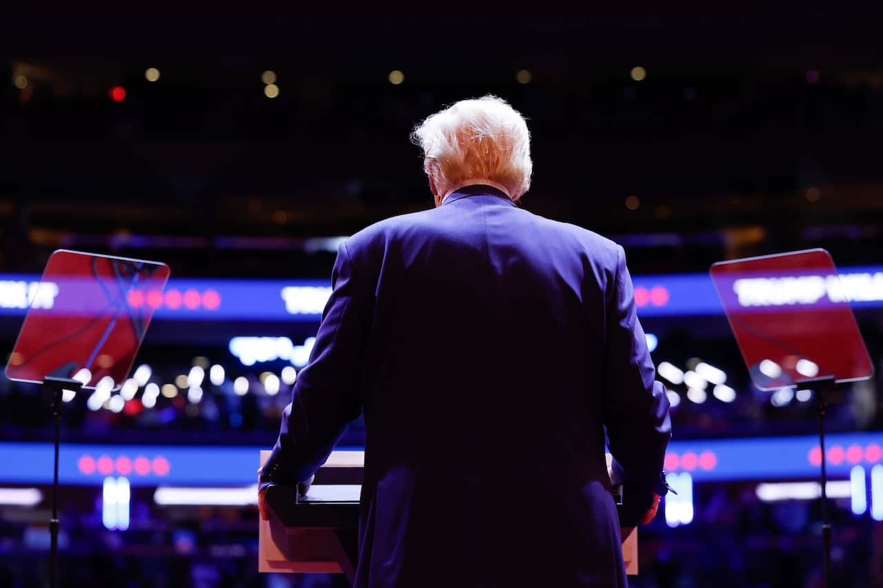 A man wearing a suit seen from behind
