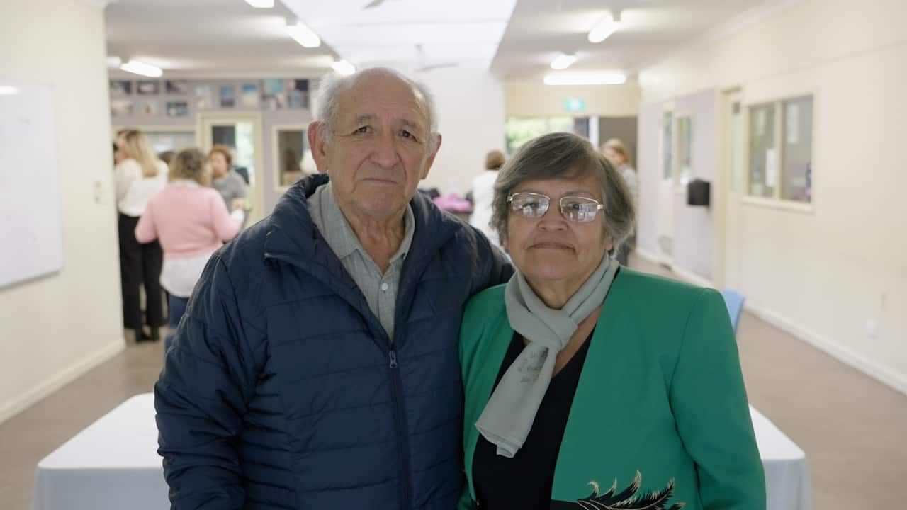 Graciela and Mario looking at the camera at the salsa class.
