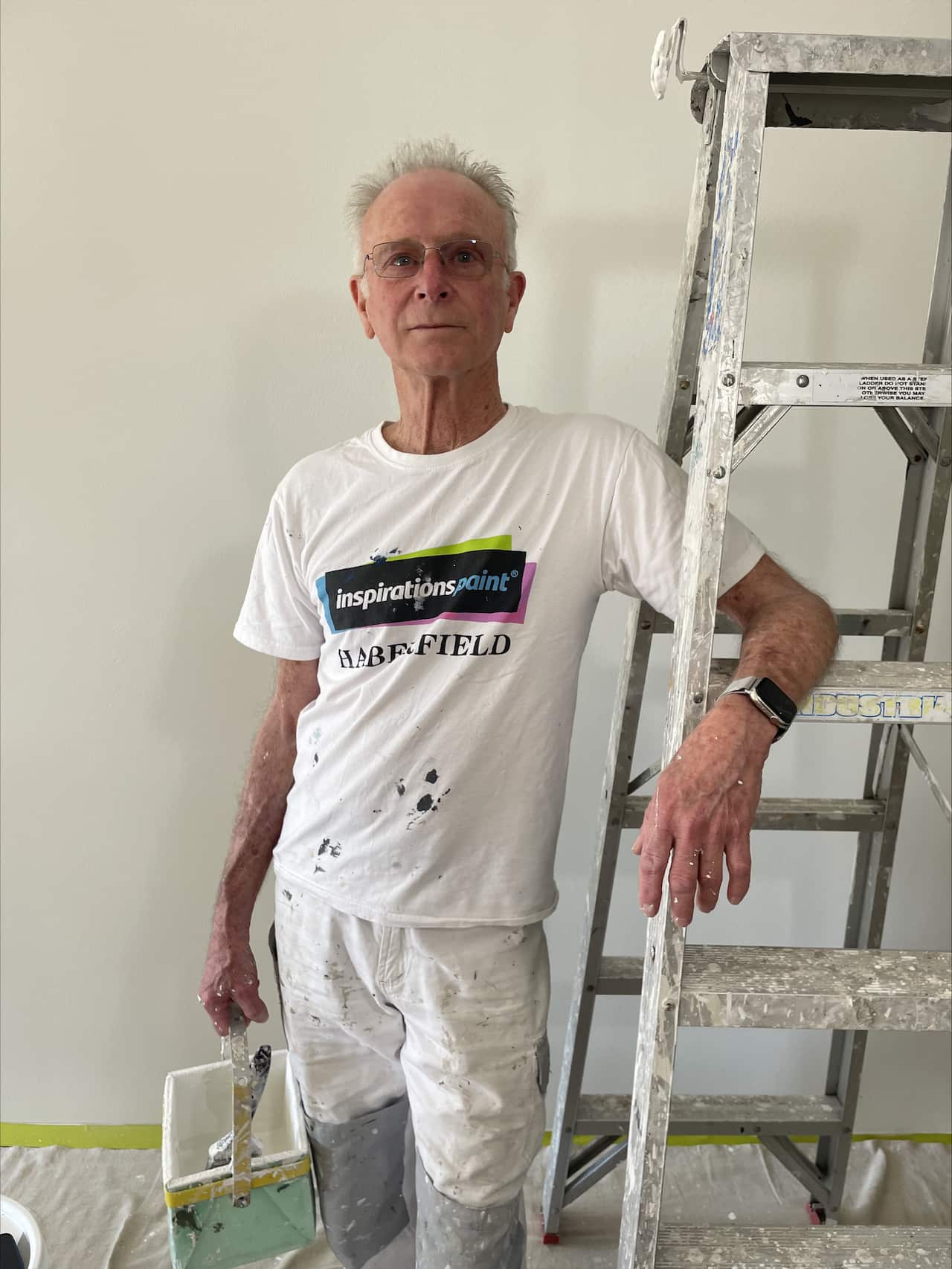 Jack Moon stands next to a ladder