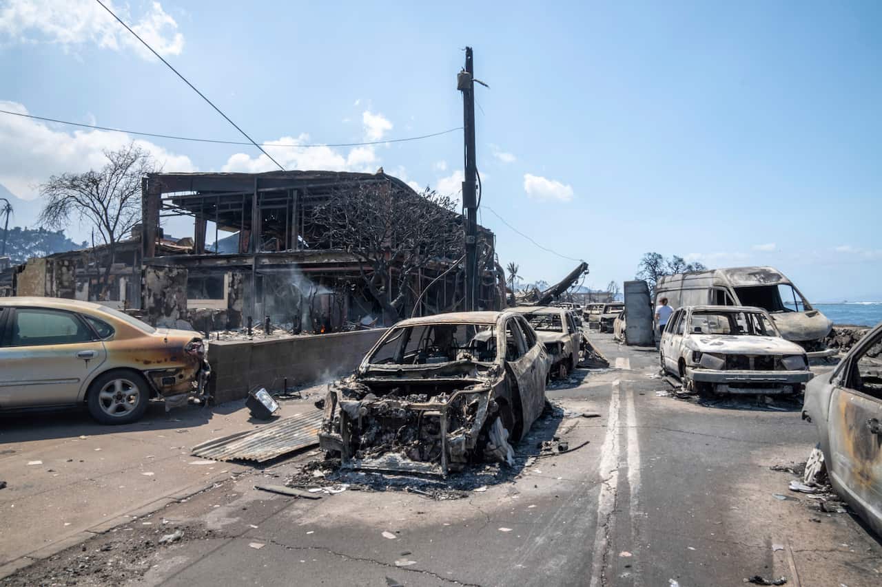 Burnt out buildings and cars in Lahaina, Hawaii after a fire