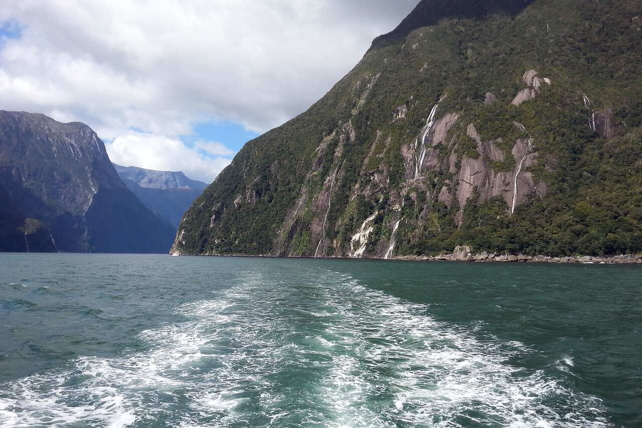 Water with mountains in the near and far distance
