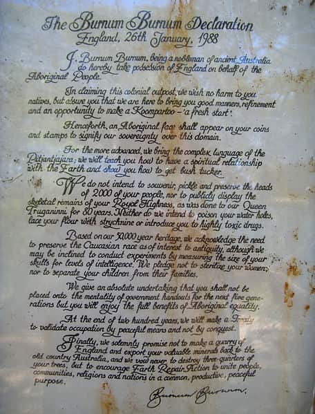 an aged piece of paper, covered with ornate calligraphy