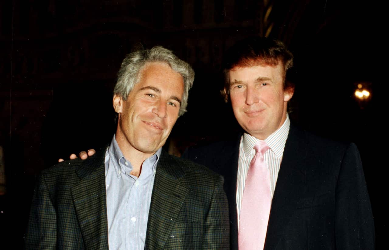 Jeffrey Epstein and Donald Trump standing next to each other and smiling. 