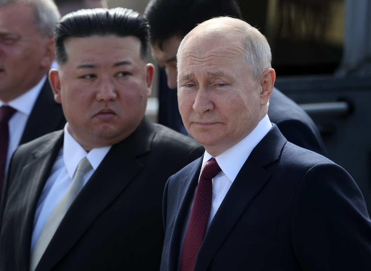 Two men in official suits: Russia's Vladimir Putin and North Korea's Kim Jong-Un 