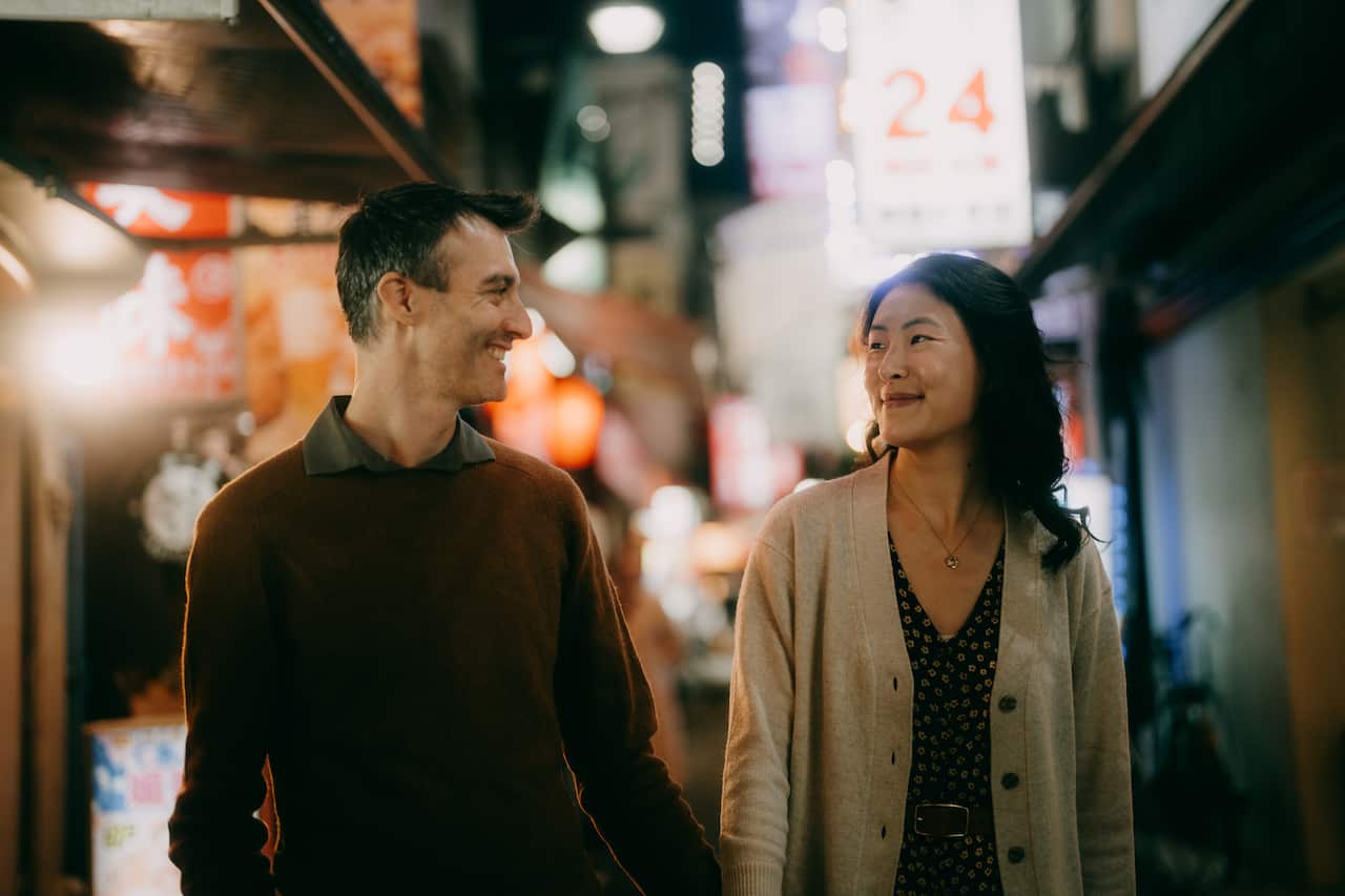 Couple enjoying Tokyo at night