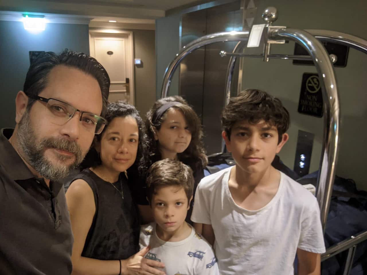 A supplied image shows Daniel Capurro, Javiera Martinez and their children at a Hotel after domestic flight delays left them stranded in Sydney. 