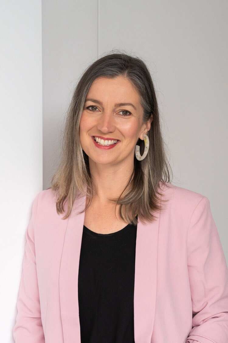 A woman smiling at camera