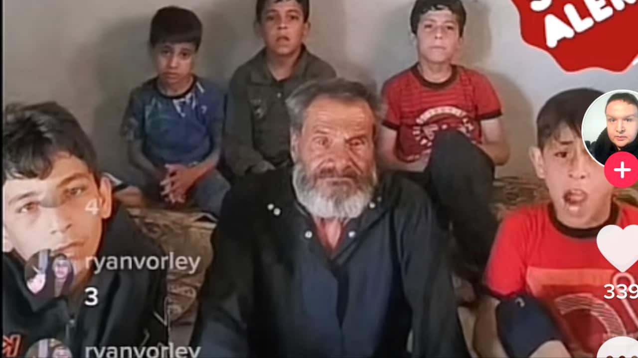 A family sits in front of a TikTok stream.