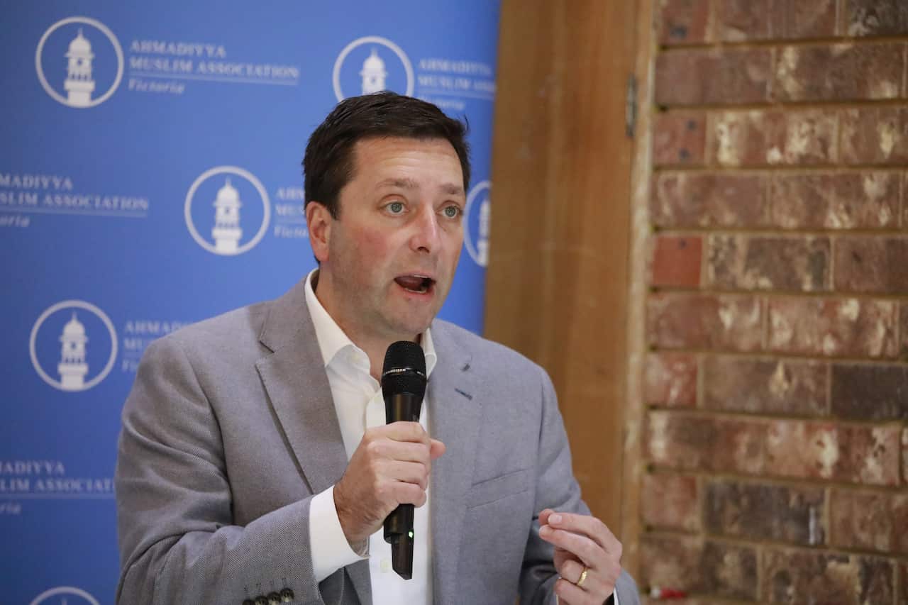 Matthew Guy with a microphone