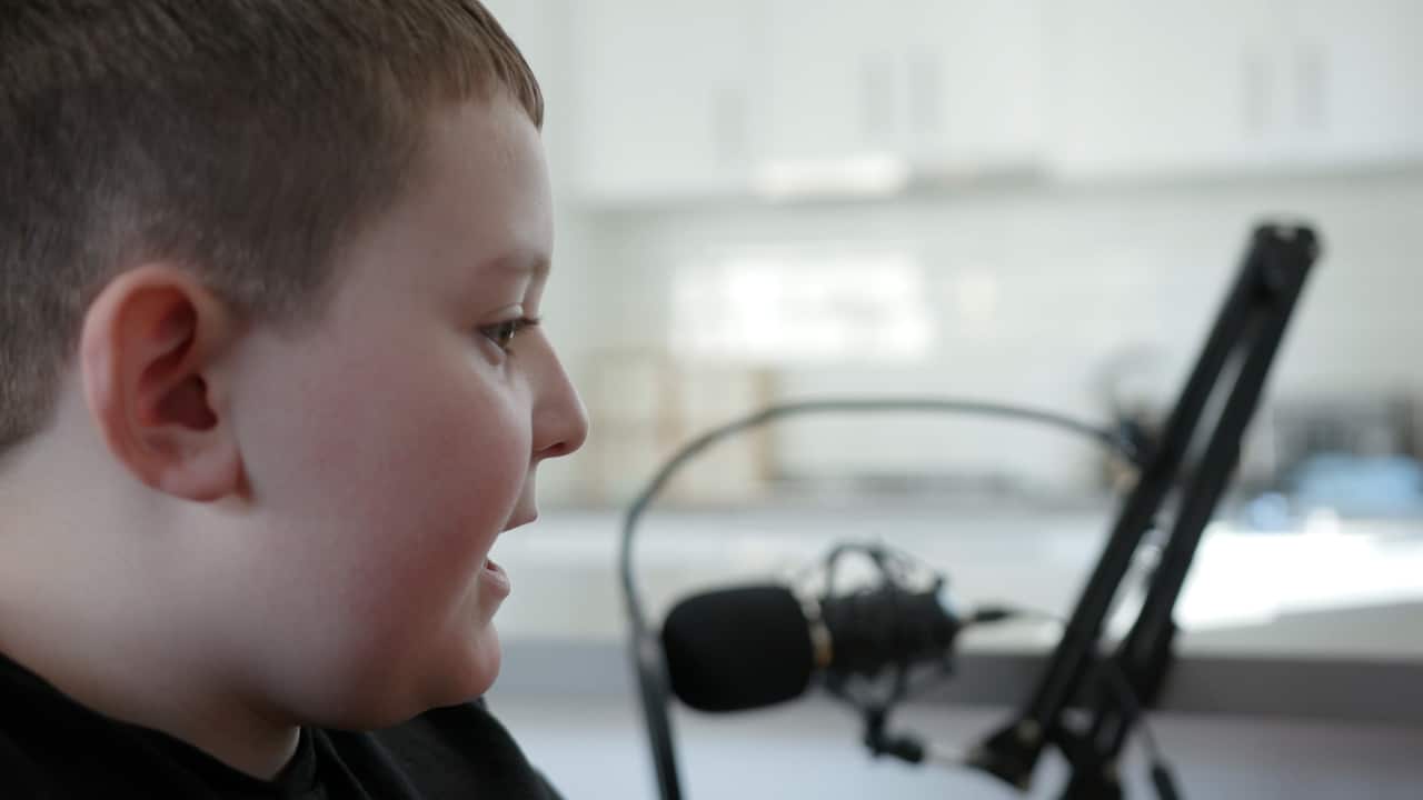 Max talks into a camera. 