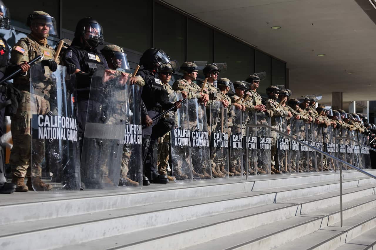 US national guard troops standing at the top of the stairs.