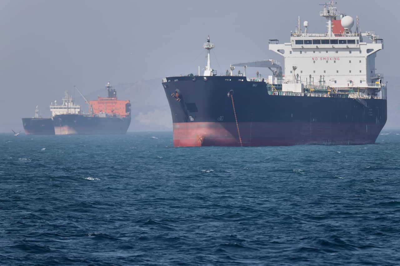 Two tankers sit anchored near the Strait of Hormuz.