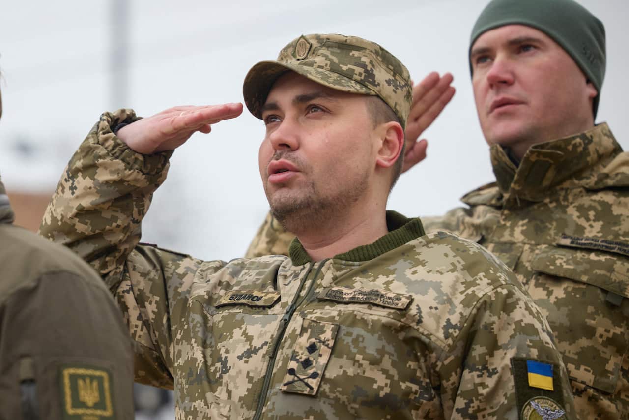 Ukraine's military intelligence chief Kyrylo Budanov stands with a salute.