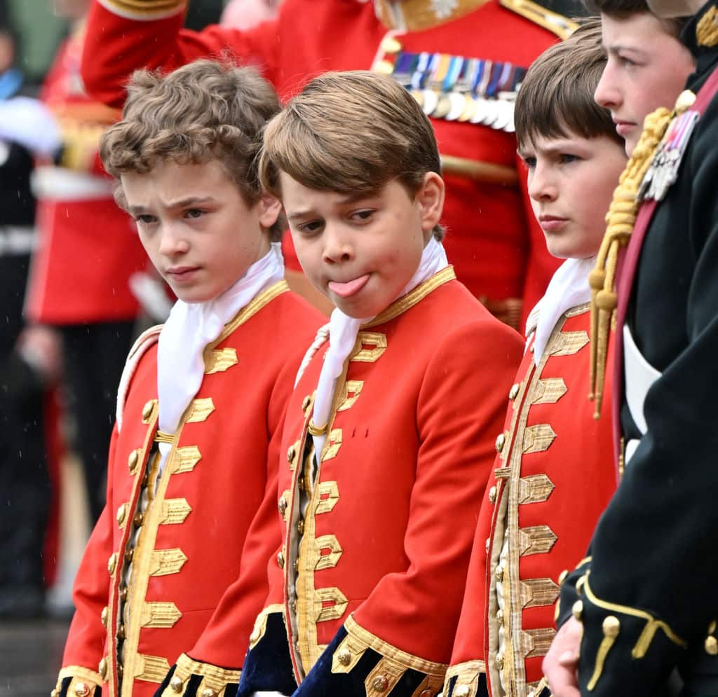 Prince George (C) arrives for the Coronation of King Charles III and Queen Camilla at Westminster Abbey.