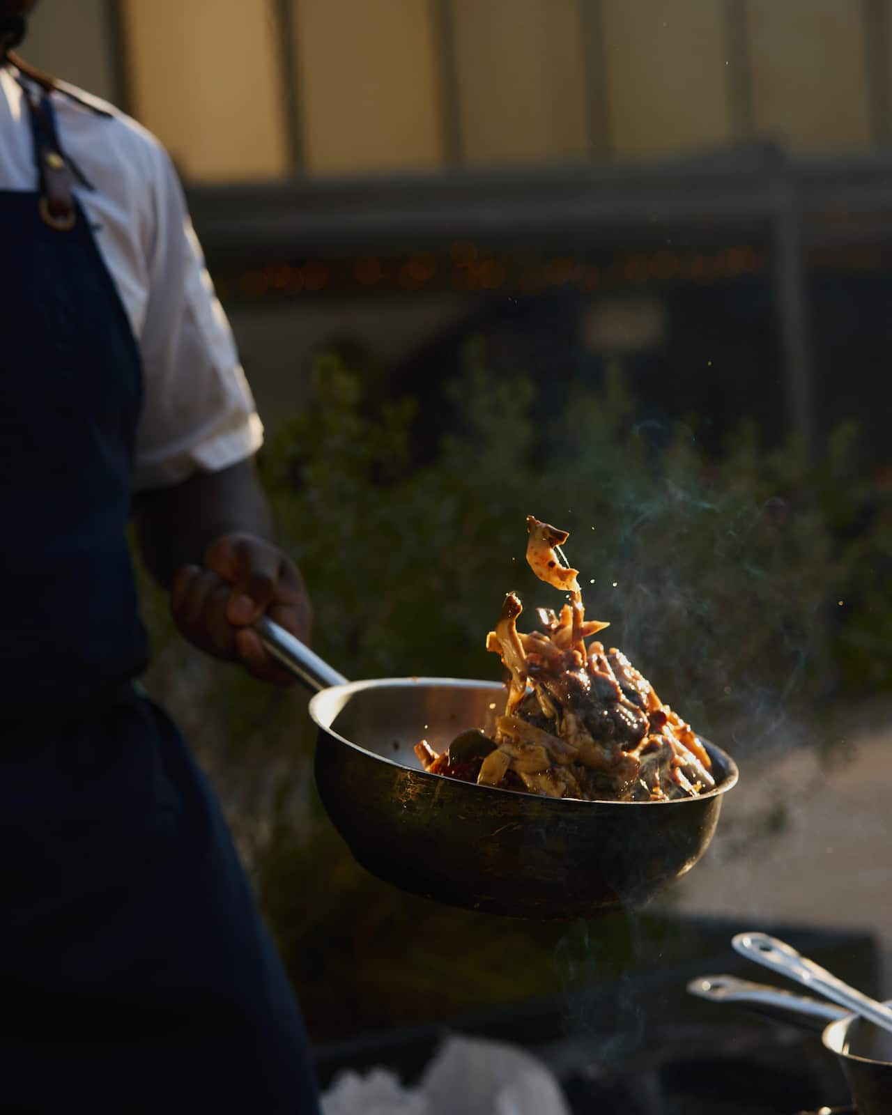Brian Cole cooking on an open fire