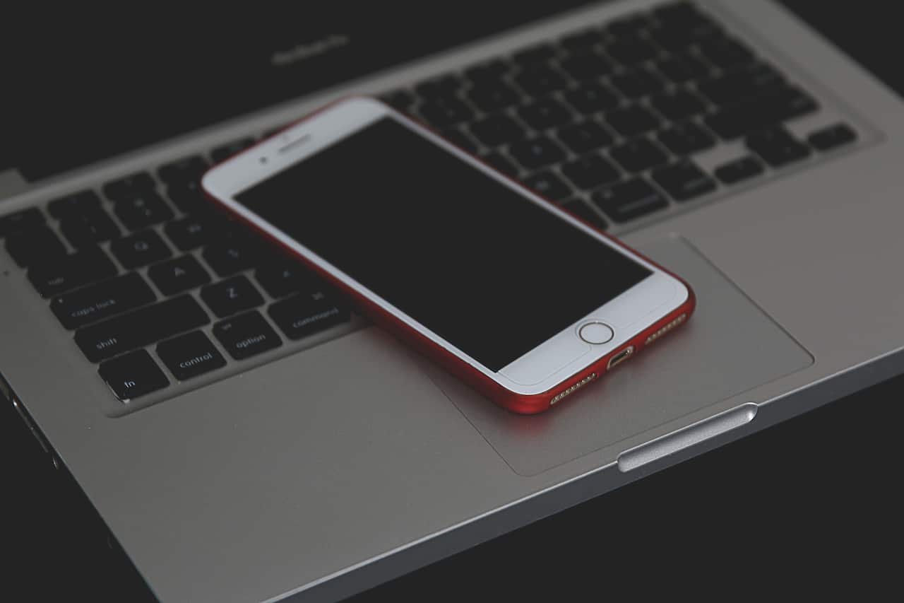 laptop, mobile-Silver iphone on laptop-pexels-joseph-redfield.jpg