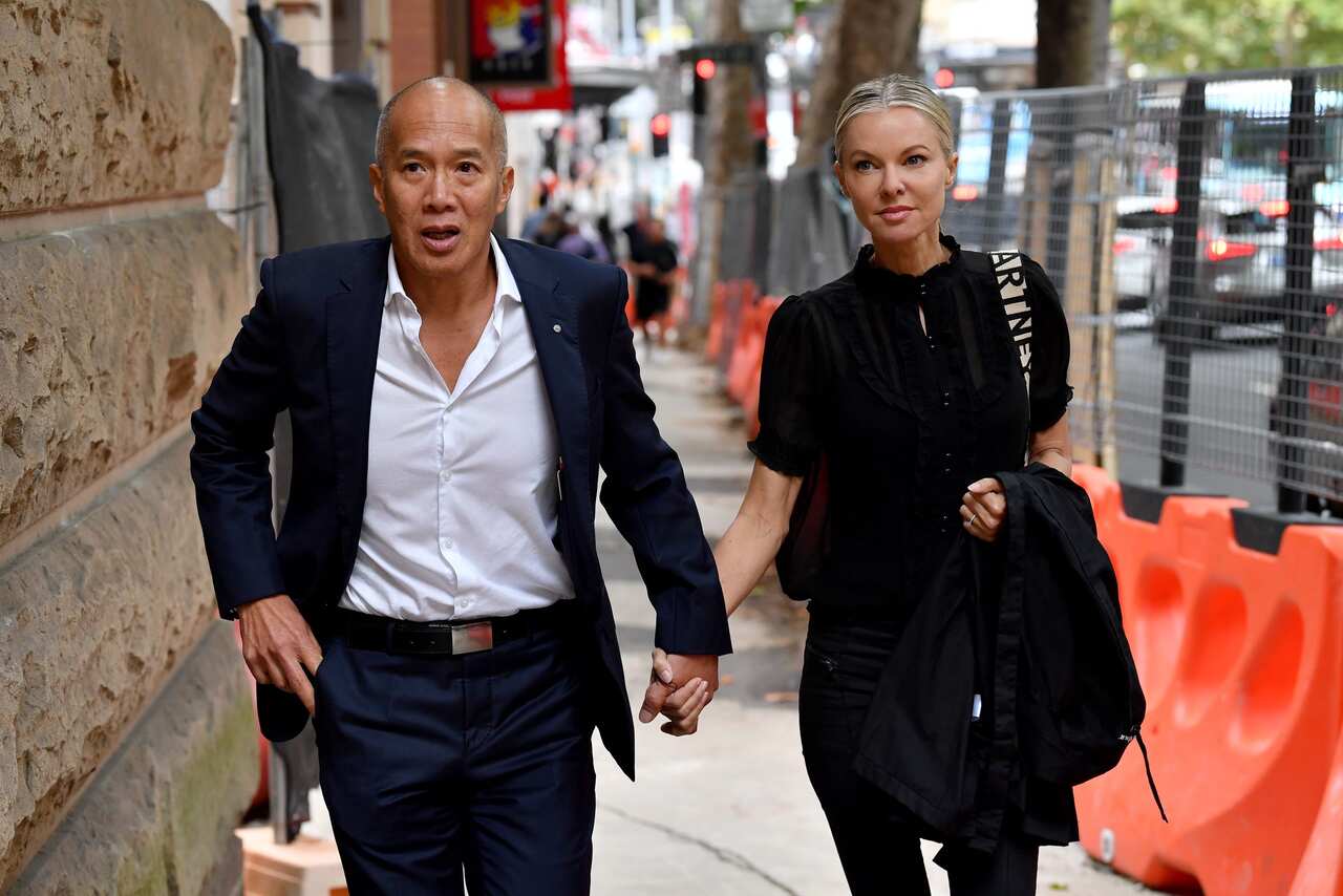Neurosurgeon Charlie Teo (left) and his fiancee Traci Griffiths arrive for an inquiry, in Sydney, Tuesday, February 14, 2023. 