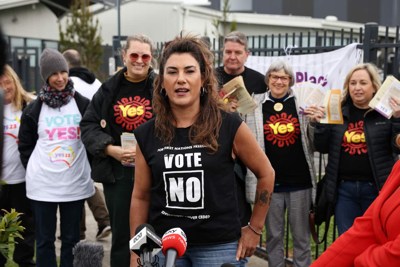 Lidia Thorpe in a black top  with a "Vote No" print.