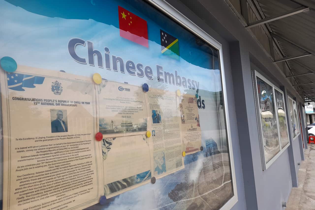 A display case of photos is seen outside the Chinese Embassy in Honiara, Solomon Islands, April 2, 2022.