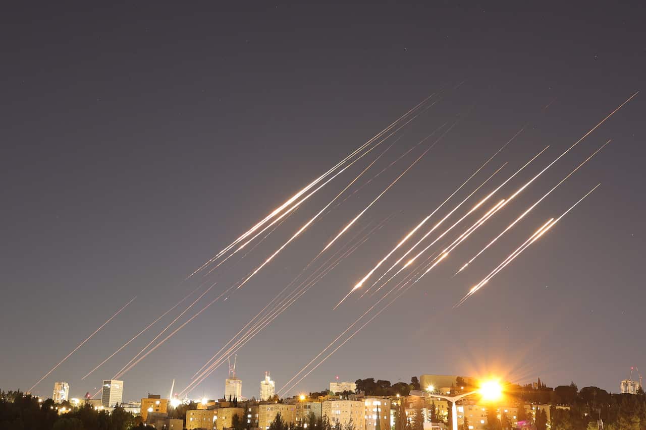 A slow exposure picture shows ballistic missiles above Jerusalem