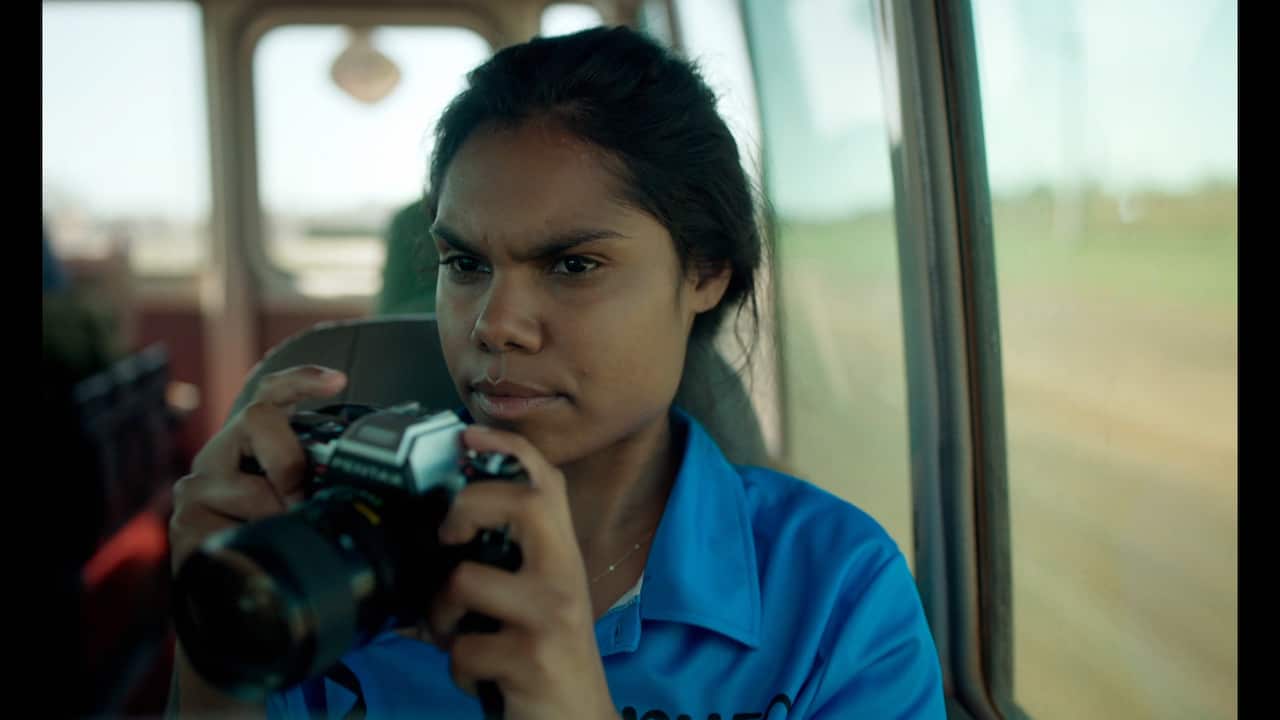 Shantae Barnes-Cowan with camera in Sweet As