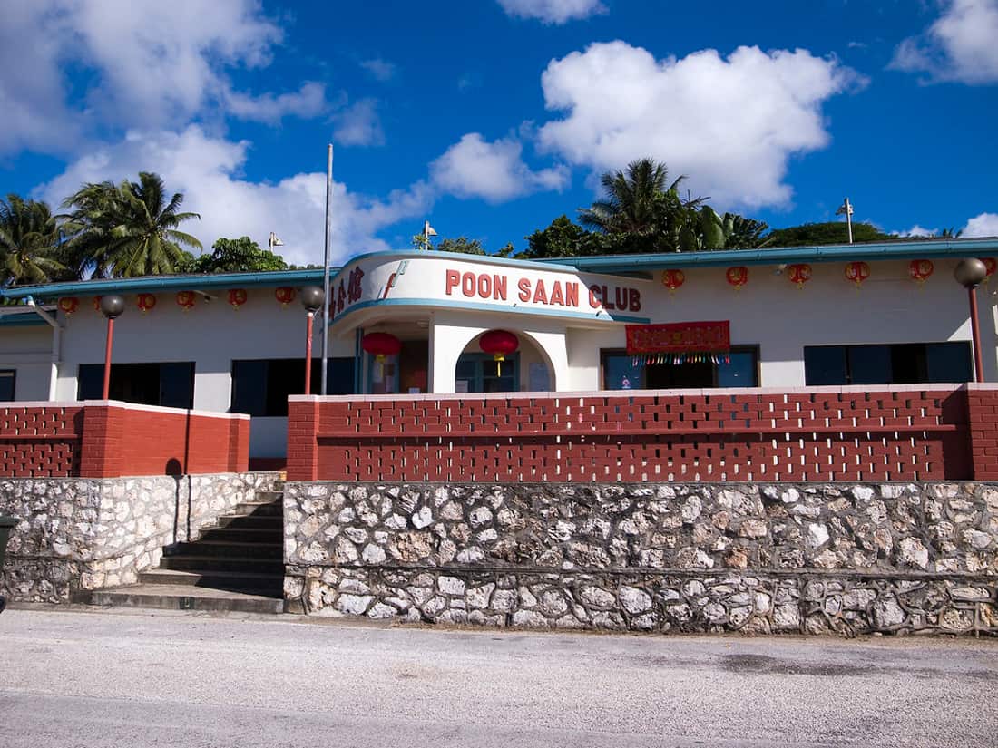 A low-rise building with Poon Saan Club written on it. 