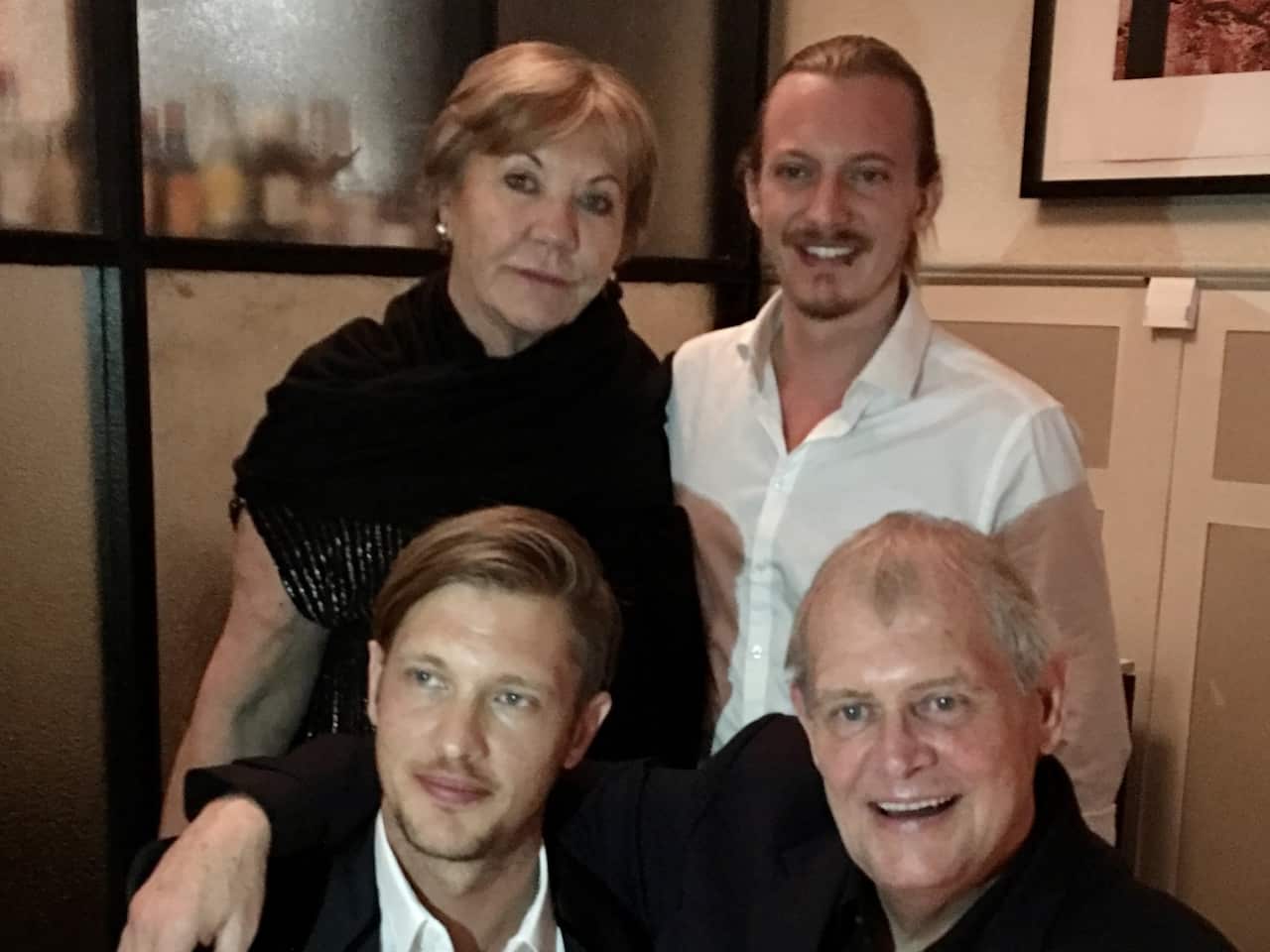 John Farnham (front right) with his wife and two sons.