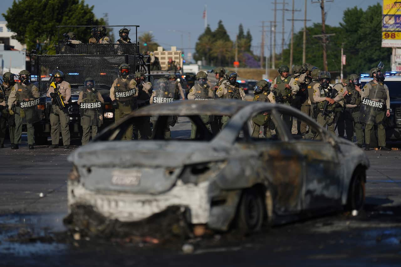 Officers stand in life during a protest. 