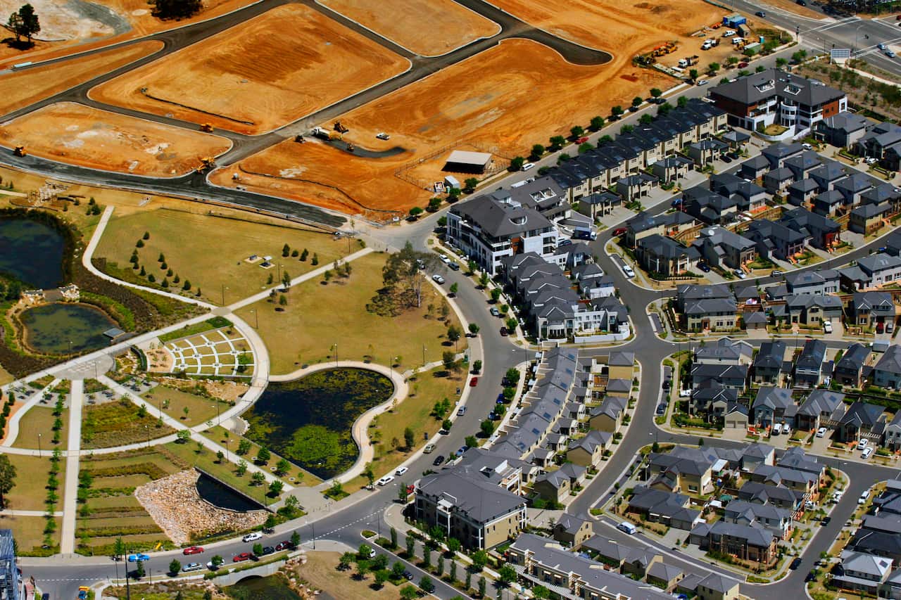 An aerial shot of a housing development showing rows of houses that look identical in Ambarvale,  South-West Sydney