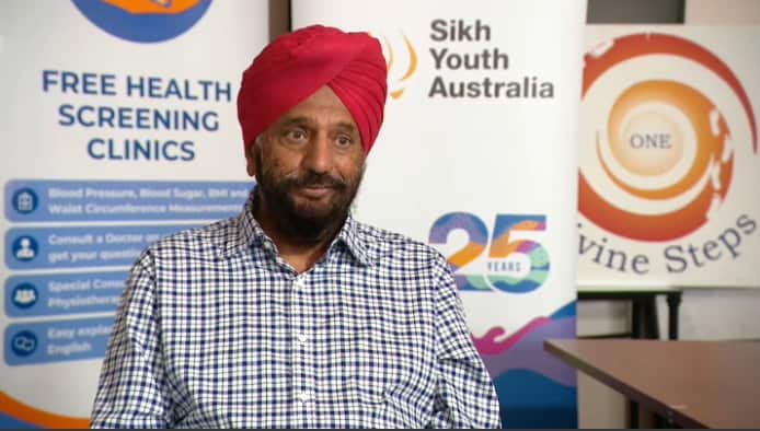 A man speaking while on camera.