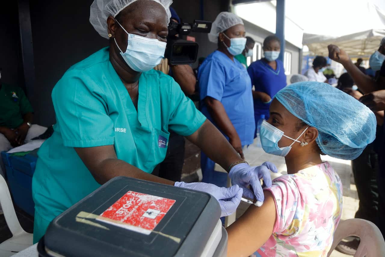 Hospital staff administer COVID-19 vaccines delivered through the global COVAX initiative in Lagos, Nigeria. 