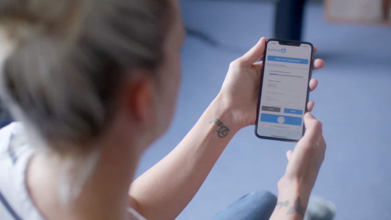 A woman holding a smartphone