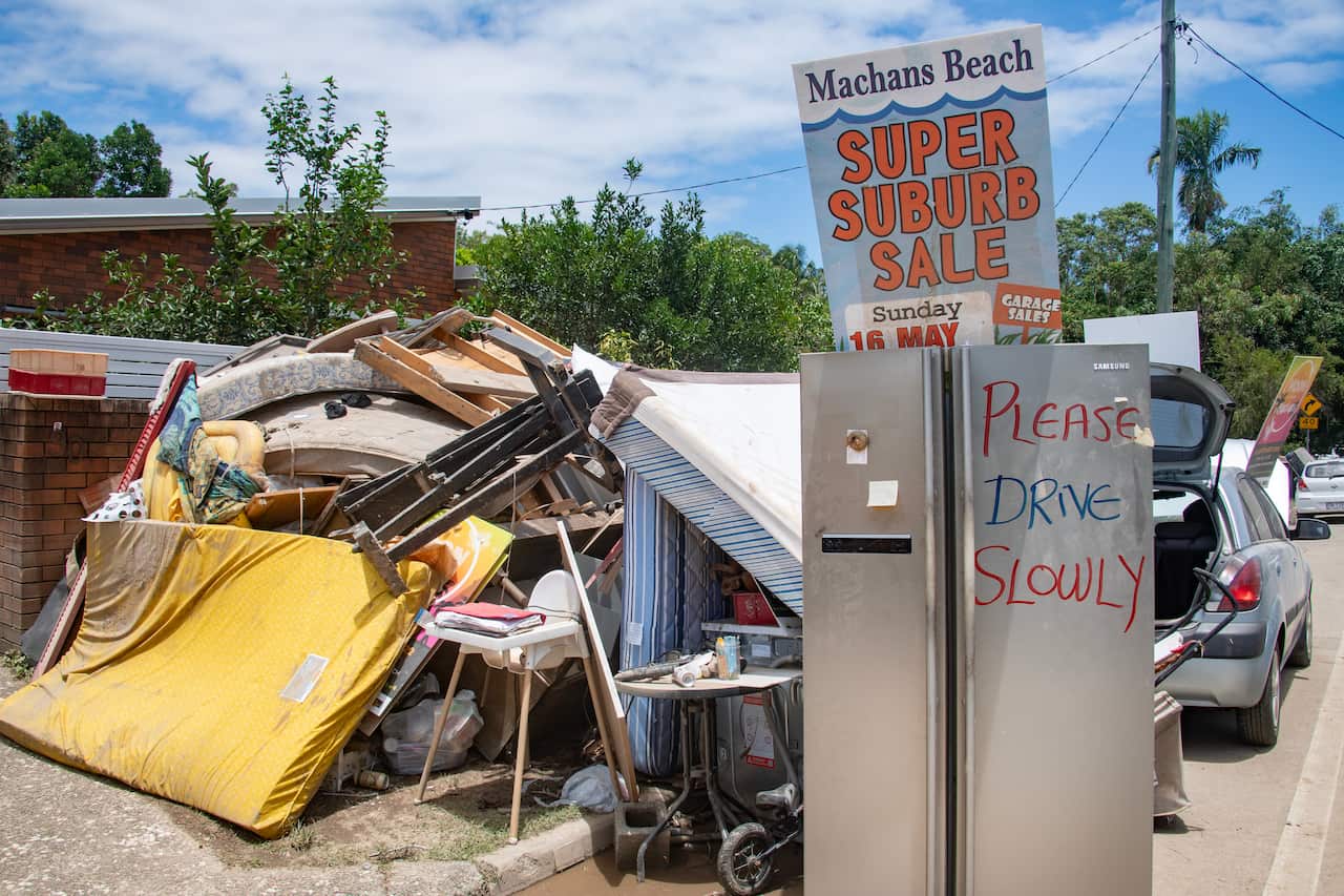 Flood damaged furniture and belongings line houses.