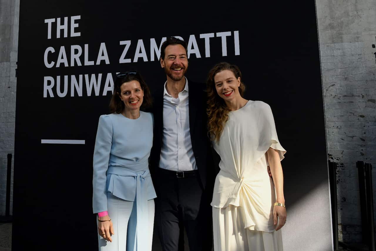 (L-R) Allegra Spender, Alex Schuman and Bianca Spender pose for a photograph during a tribute to fashion designer Carla Zampatti at Australian Fashion Week 2021 in Sydney, 