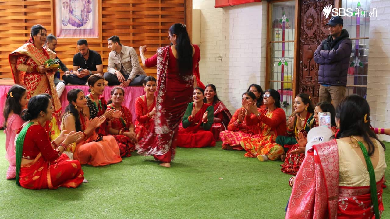 Nepali women sing and dance at Mukti-Gupteshwar Temple in Minto, Sydney during Teej, on 30 August 2022.