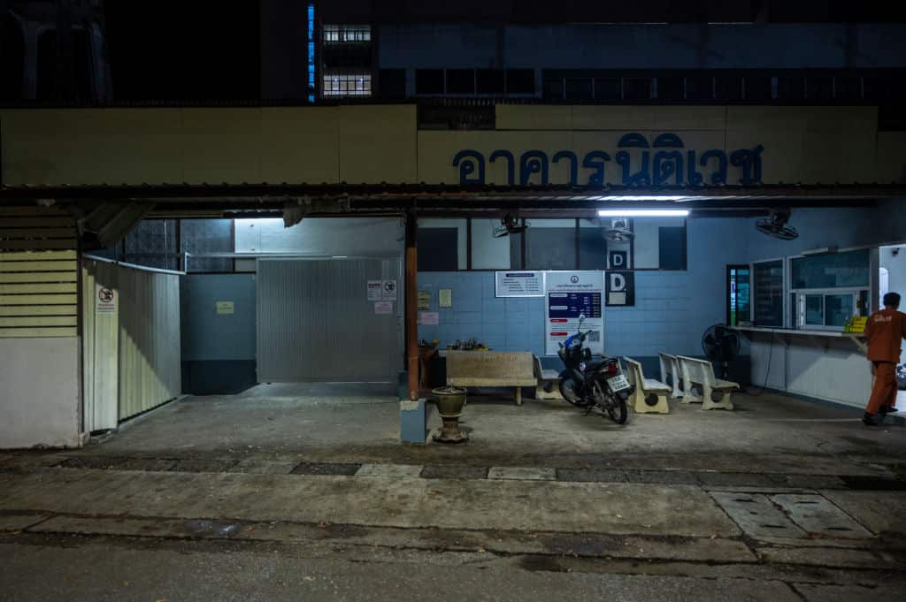 A mortuary technician enters the morgue at Suratthani Hospital where the autopsy of Shane Warne was conducted in Surat Thani, Thailand.