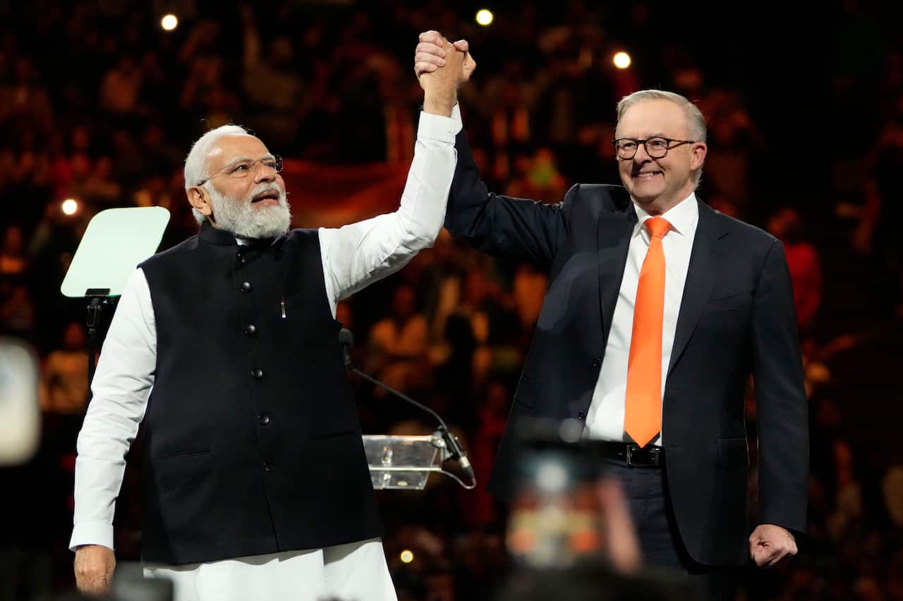 Two men standing on stage.